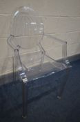 AFTER PHILIPE STARCK FOR KARTELL, a clear louis ghost armchair, unsigned (the item in this lot is