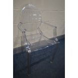 AFTER PHILIPE STARCK FOR KARTELL, a clear louis ghost armchair, unsigned (the item in this lot is