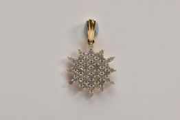 A 9CT GOLD DIAMOND PENDANT, of a snowflake outline, set with a cluster of claw mounted, single cut