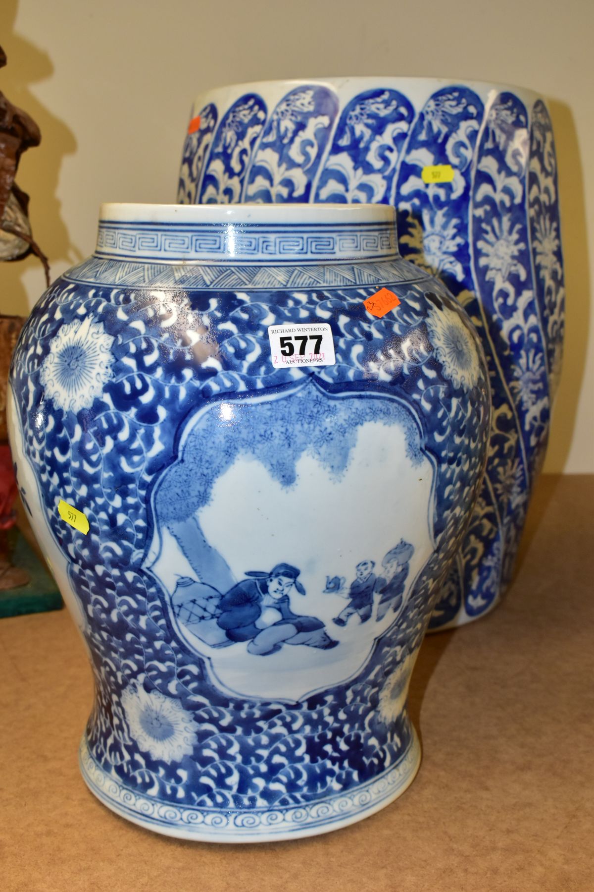 A MODERN CHINESE BARREL STOOL OF WRYTHERN FORM, blue and white floral decoration, approximate height