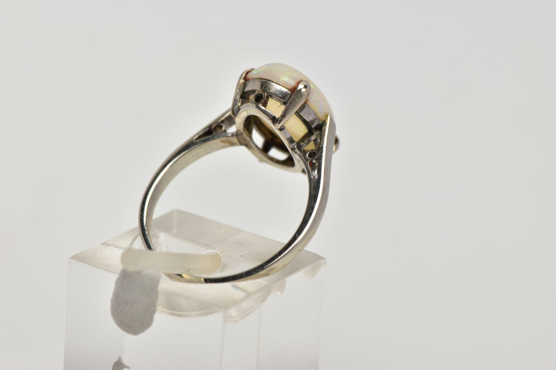 A WHITE METAL OPAL RING, designed with a four-claw set, oval opal cabochon, plain polished shank, - Image 3 of 4