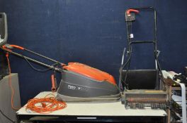 A FLYMO TURBO COMPACT 380 LAWN MOWER (PAT pass and working) and a Black and Decker Lawn Raker (
