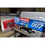 JAMES BOND, three remote control race car and tracks (boxed), comprising the micro-scalextric