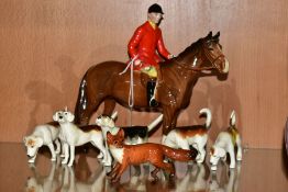 A BESWICK HUNTSMAN, FOX AND FIVE FOXHOUNDS, the Huntsman, style two standing, brown gloss model