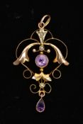 AN EARLY 20TH CENTURY AMETHYST AND SPLIT PEARL PENDANT, of an openwork floral and scroll design, set