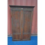 A GEORGIAN MAHOGANY PANELLED TWO DOOR CUPBOARD, width 110cm x depth 37cm x height 182cm (the item in