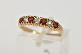 A 9CT GOLD HALF ETERNITY RING, designed with a row of four circular cut garnets, interspaced with