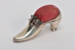 AN EDWARDIAN SILVER PIN CUSHION, modelled as a shoe with a buckle, fitted with a red cushion,