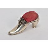 AN EDWARDIAN SILVER PIN CUSHION, modelled as a shoe with a buckle, fitted with a red cushion,