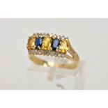 A 9CT GOLD SAPPHIRE AND DIAMOND DRESS RING, designed with a central row of four-claw set, oval cut