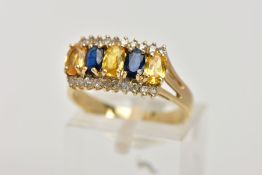 A 9CT GOLD SAPPHIRE AND DIAMOND DRESS RING, designed with a central row of four-claw set, oval cut