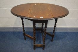 A SMALL OAK BARLEY TWIST OVAL GATE LEG TABLE, length 91cm x closed width 36cm x depth 62cm x