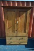 A VICTORIAN PINE HOUSEKEEPERS CUPBOARD, the double panelled cupboard doors enclosing a single shelf,