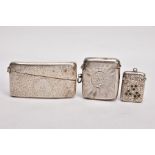 A SILVER CARD CASE AND TWO VESTAS, the card case decorated with an engraved foliate design and