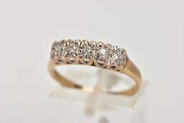 A 9CT GOLD FIVE STONE DIAMOND RING, designed with a row of five illusion set round brilliant cut