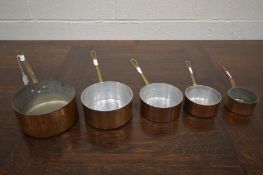 FIVE COPPERED GRADUATING PANS