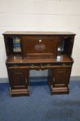 AN EARLY TO MID 20TH CENTURY OAK DESK, with a central fall front door, and two drawers, width