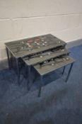 A 1970'S CHROME NEST OF THREE TABLES, in the manner of Adri Belgique, with abstract design tile top,