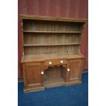 A VICTORIAN PINE DRESSER, with a later top, width 168cm x depth 43cm x height 182cm (the item in