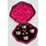 A CASED SET OF FOUR LATE VICTORIAN SILVER SALTS, each with embossed swag floral decoration and