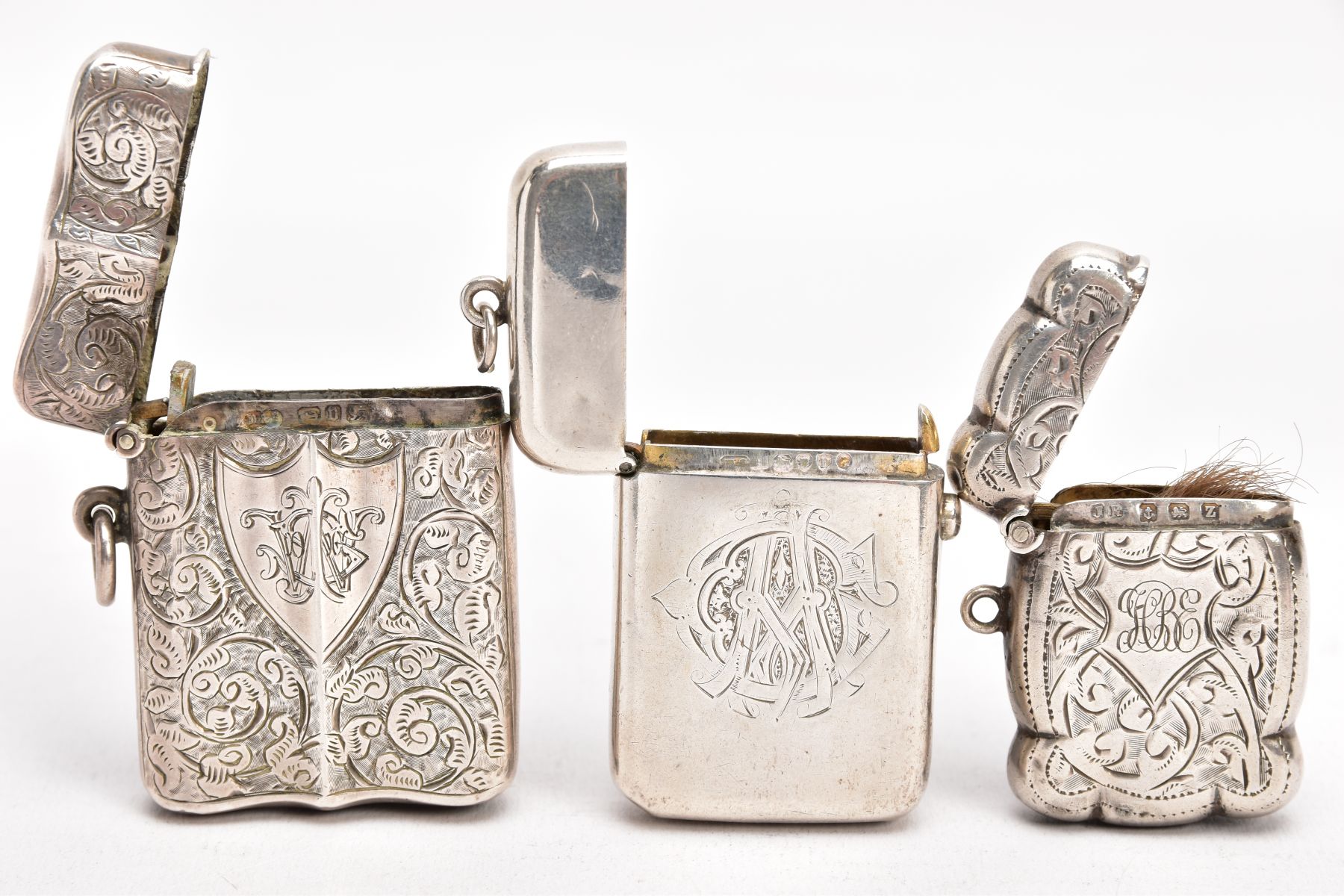 TWO LATE VICTORIAN SILVER VESTAS, AN EARLY 20TH CENTURY VESTA, AND A SMALL CERAMIC FIGURE, the first - Image 5 of 5