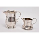 TWO EARLY 20TH CENTURY SMALL SILVER CREAM JUGS, the first of baluster shape with stepped circular