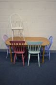 A BEECH DINING TABLE, and five chairs, all painted in different colours, including two Ercol kitchen