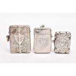 TWO LATE VICTORIAN SILVER VESTAS, AN EARLY 20TH CENTURY VESTA, AND A SMALL CERAMIC FIGURE, the first