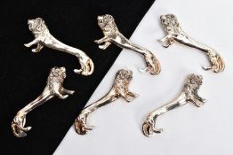 A SET OF SIX WHITE METAL KNIFE RESTS, each in the form of a lion, length 7.5cm each (condition