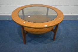 A SCHREIBER CIRCULAR TEAK GLASS TOP TWO TIER COFFEE TABLE, diameter 84cm