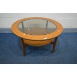 A SCHREIBER CIRCULAR TEAK GLASS TOP TWO TIER COFFEE TABLE, diameter 84cm