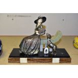AN ART DECO SPELTER MARBLE AND CHRYSELEPHANTINE EFFECT FIGURE GROUP OF A LADY HOLDING A BOUQUET OF