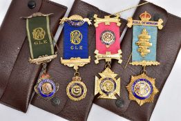 FOUR SILVER MASONIC FOB MEDALS, to include three silver gilt medals, each engraved and fitted with