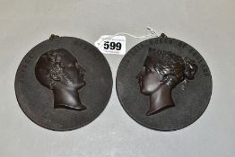 A PAIR OF VICTORIAN BOIS DURCI PORTRAIT RELIEF RONDELS, depicting 'Victoria Queen of England' and '