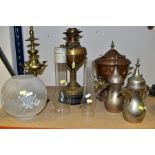 A GROUP OF METALWARES WITH GLASS LAMPSHADE AND CHIMNEYS comprising two Arabic dallah coffee pots,