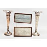 A PAIR OF SILVER POSY VASES AND TWO WHITE METAL PICTURES IN FRAMES, the posy vases of a tapered