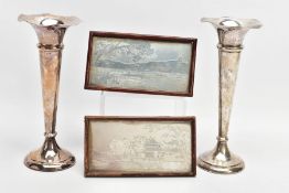 A PAIR OF SILVER POSY VASES AND TWO WHITE METAL PICTURES IN FRAMES, the posy vases of a tapered