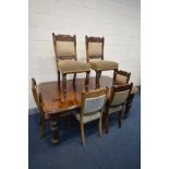 AN EDWARDIAN MAHOGANY WIND OUT DINING TABLE, with two additional leaves, on turned legs, extended