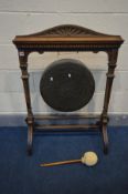 A LATE VICTORIAN MAHOGANY FRAMED DINNER GONG, with square supports and swept legs, width 76cm x