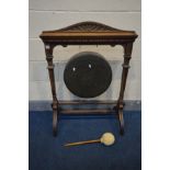A LATE VICTORIAN MAHOGANY FRAMED DINNER GONG, with square supports and swept legs, width 76cm x