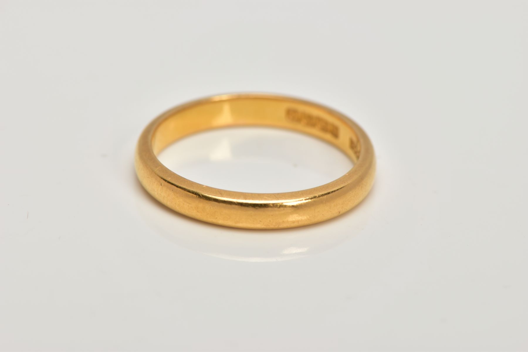 A 22CT GOLD WEDDING BAND, of a plain polished design, hallmarked 22ct gold Birmingham, ring size - Image 2 of 2