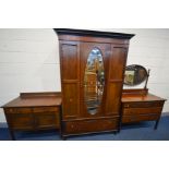 AN EDWARDIAN MAHOGANY THREE PIECE BEDROOM SUITE comprising a dressing chest with an oval swing