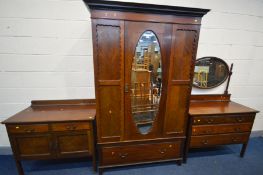 AN EDWARDIAN MAHOGANY THREE PIECE BEDROOM SUITE comprising a dressing chest with an oval swing