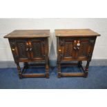 A PAIR OF REPRODUX OAK TWO DOOR CABINETS, on turned legs united by a box stretcher, width 51cm x