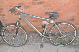 A GENTS MOUNTAIN BIKE with front and rear suspension, 21 speed Shinano gears and a 18in frame