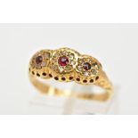 A 1930'S 18CT GOLD GARNET AND DIAMOND RING, designed as three graduated circular garnets within