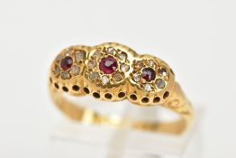 A 1930'S 18CT GOLD GARNET AND DIAMOND RING, designed as three graduated circular garnets within