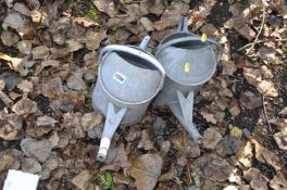 TWO VINTAGE GALVANISED WATERING CANS (one has a non flat bottom)
