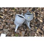 TWO VINTAGE GALVANISED WATERING CANS (one has a non flat bottom)