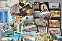 POSTCARDS. Approximately 500 mid-late 20th century postcards in one box and an album together with a